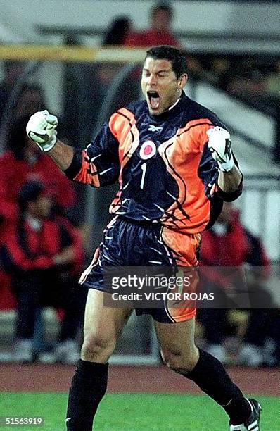 Colombian goalkeeper Oscar Cordoba celebrates Colombian goal against Chile 02 September 2000, during Japan-Korea 2002 World Cup qualification game at...