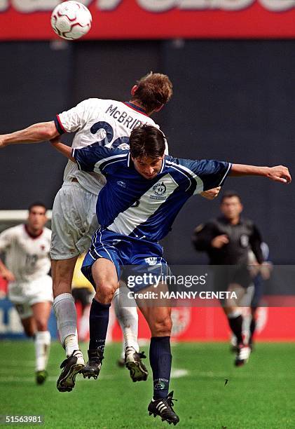 Guatemala's Erick Miranda battles a header against Brian McBride of the US during their fourth round World Cup qualifying match at the RFK Stadium 03...