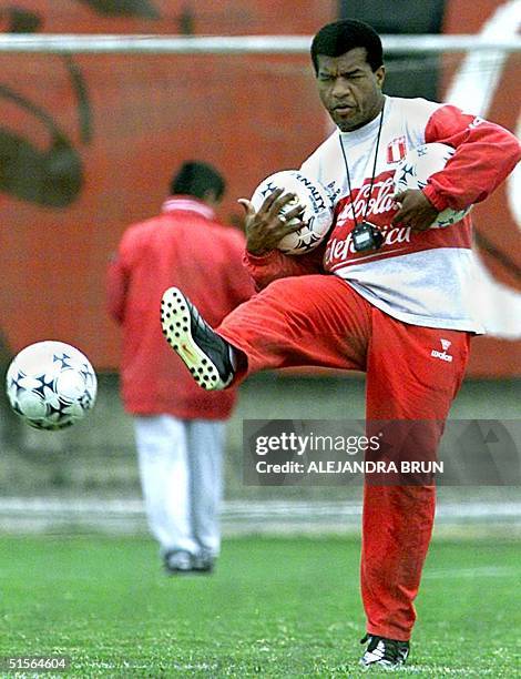 Peruvian Julio Cesar Uribe, new tecnical director of the Peruvian selection of soccer, kicks balls during training in the National sport villa, in...