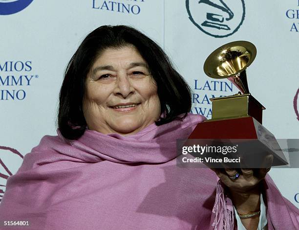 Argentinian singer-composer Mercedes Sosa holds her Latin Grammy for Best Folk Album for "Misa Criolla" at the first annual Latin Grammy Awards at...