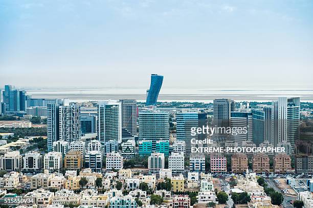 urban part of abu dhabi viewed from the air - abu dhabi oil stock pictures, royalty-free photos & images