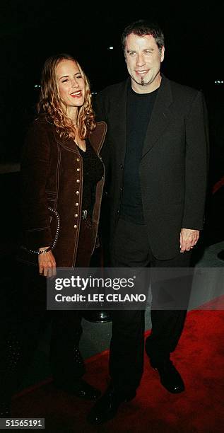 Actor John Travolta and his wife Kelly arrive for Barabara Streisand's concert 20 September 2000 at the Staples Center in Los Angeles. Streisand is...