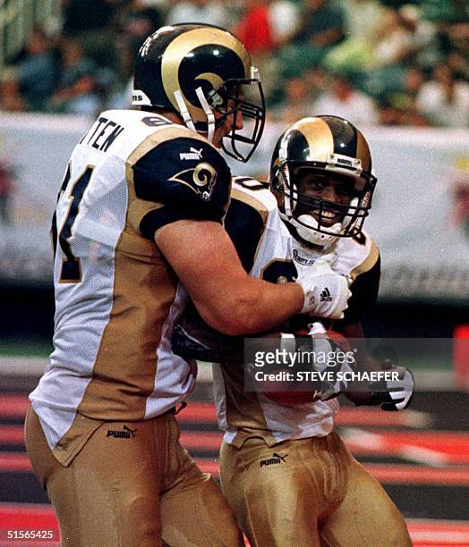 Saint Louis Rams Tom Nutten congratulates Isaac Bruce after he cought a 66 yard, forth quarter touch down pass during their game with Atlanta Falcons...