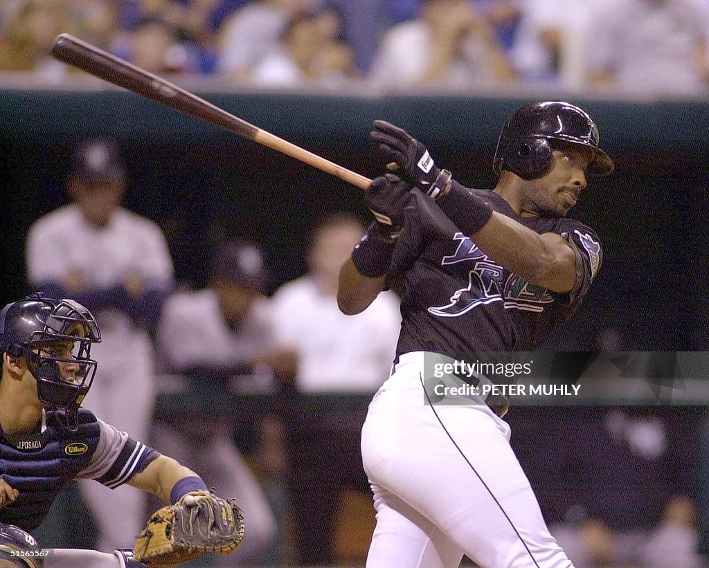 Tampa Bay Devils Rays' Fred McGriff hits a groundb
