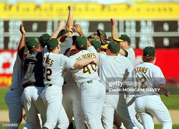 Oakland Athletics players celebrate after the A's clinched the American League West title, 01 October 2000, in Oakland, California. The A's beat the...