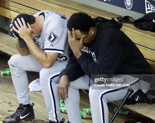 The Chicago White Sox pitchers James Baldwin and Kelly Wensch hold their heads after losing to the Seattle Mariners 2-1 to win the American League...