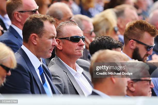 Former teammates Ben Graham and John Barnes listen on during the memorial service for Paul Couch at Simonds Stadium on March 15, 2016 in Geelong,...