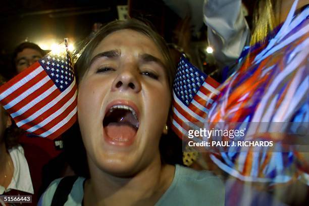 Republician presidential candidate and Texas Governor George W. Bush supporter Katie Bradbury of Washington, North Carolina, screams with the crowd...