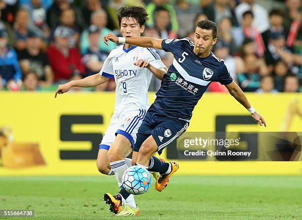 Jang Hyunsoo of Suwon and Daniel Georgievski of the Victory compete for the ball during the AFC Champions League match between the Melbourne Victory...