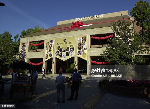 The Grand Ole Opry House in Nashville, Tennessee, is shown wrapped in a red bow in honor of the Grand Ole Opry's 75th Birthday on 13 October 2000. A...