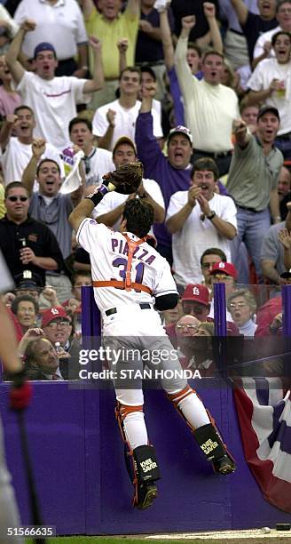 New York Mets catcher Mike Piazza is cheered by fans as he catches a pop foul to end the 3rd inning for the St. Louis Cardinals during game three of...