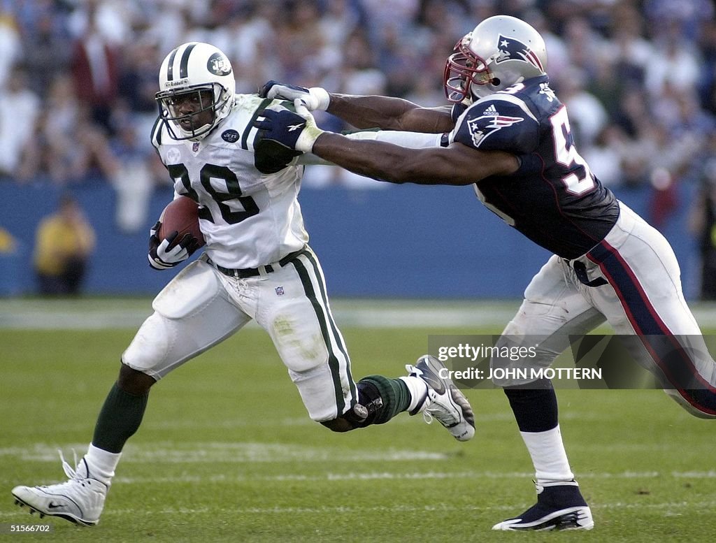 Chris Slade (R) of the New England Patriots puts t