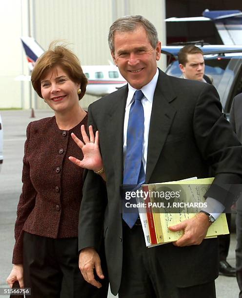 Republican presidential candidate and Texas Governor George W. Bush and his wife Laura walk to the steps of his campagn aircraft, "Responsibility...