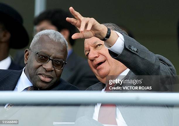 Chilean President Ricardo Lagos talks with the Senegals Laminates Diack, president of the International Federation of Amateur Athletics, during the...