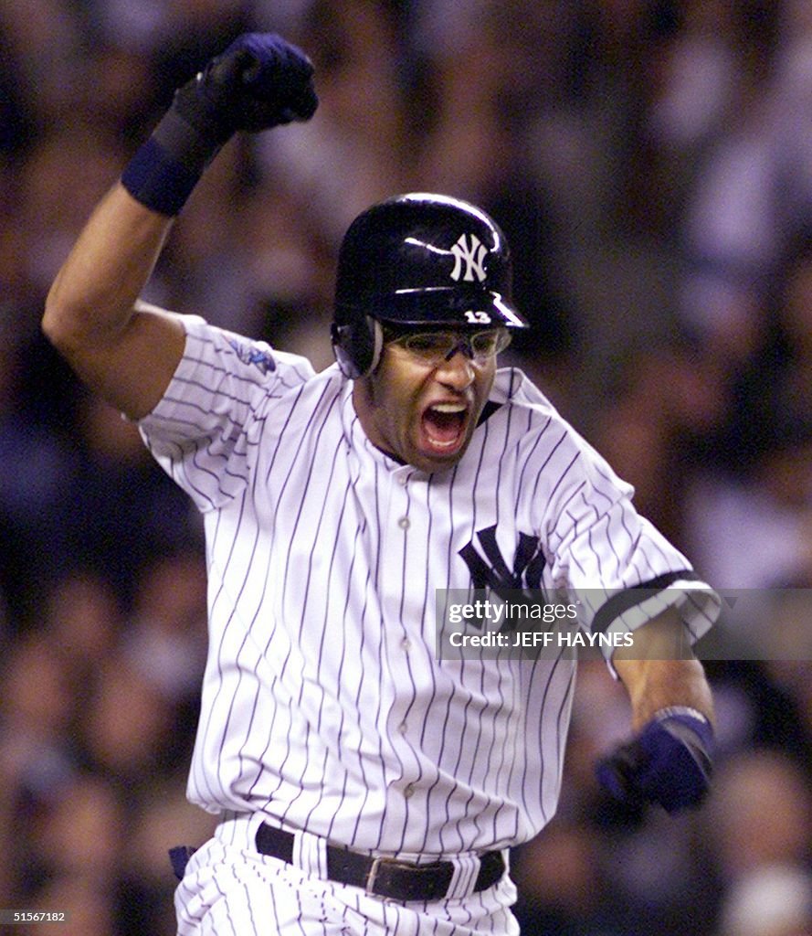 Jose Vizcaino of the New York Yankees celebrates h