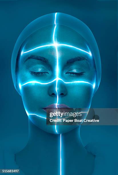 laser beams passing through the face of a lady - scanner medico foto e immagini stock