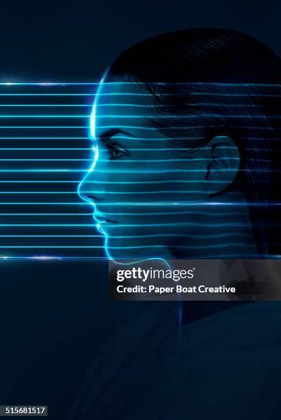 laser beams passing through the face of a lady - high tech beauty stock-fotos und bilder