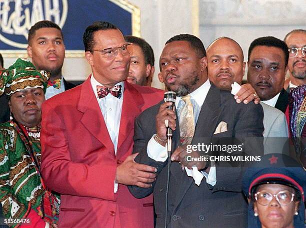 Nation of Islam leader Louis Farrakhan puts his arm around Christian cleryman Al Sampson as he speaks in support of Farrakhan 17 Jaunary in Chicago....