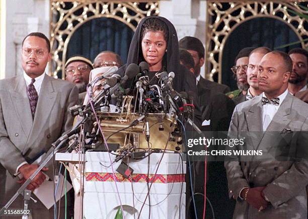 Ava Mohammad, attorney for the Nation of Islam, is flanked by group members 13 January as she speaks at a news conference in Chicago on the arrest of...