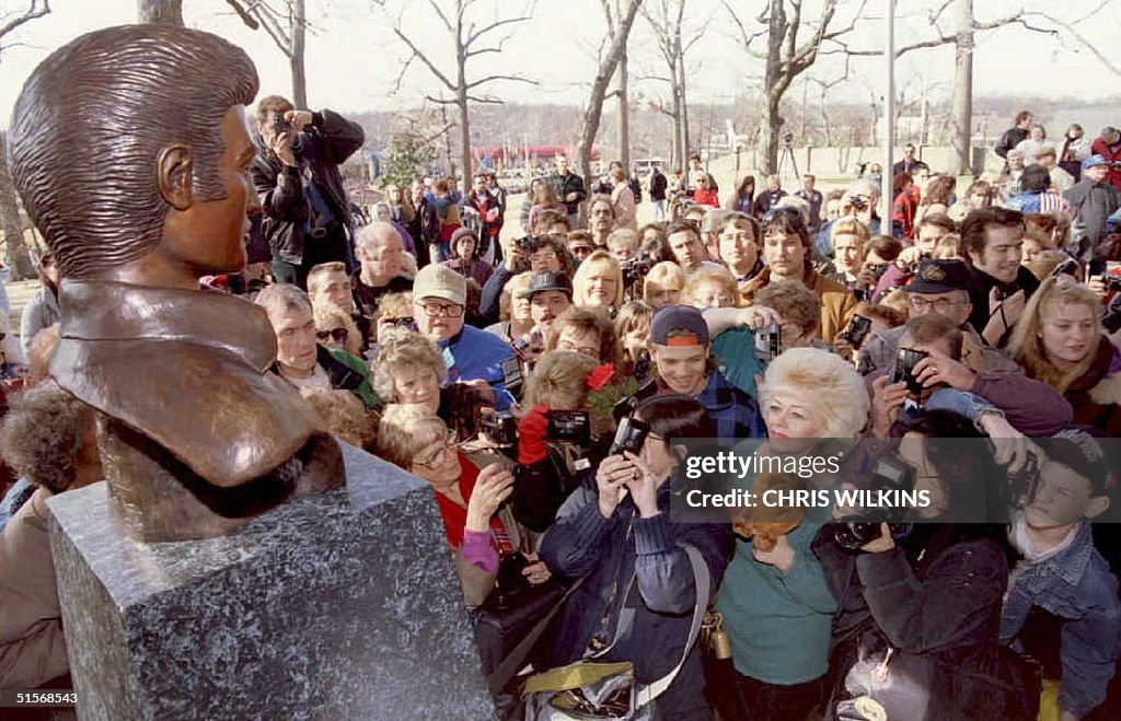 Elvis Presley fans crowd to get a glimpse of a new