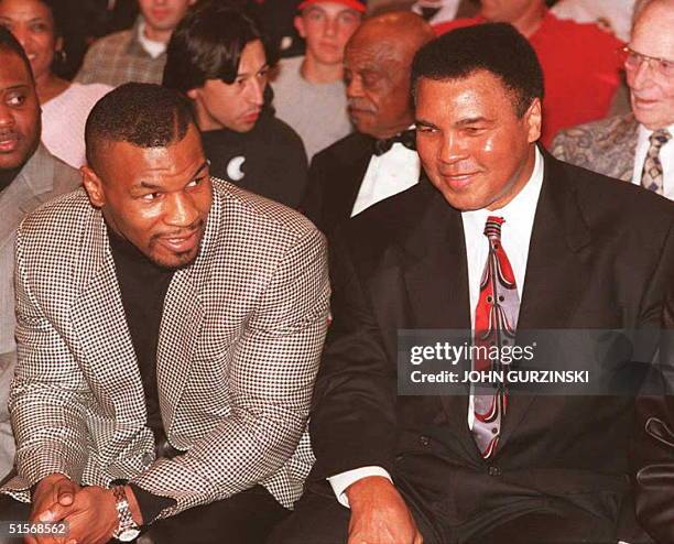 Former heavyweight boxing champion Mike Tyson speaks with boxing legend Muhammad Ali, 22 February, at the University of Nevada, Las Vegas student...