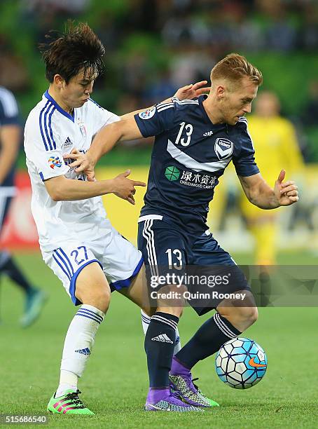 Seongsoo of Suwon and Oliver Bozanic of the Victory compete for the ball during the AFC Champions League match between the Melbourne Victory and...