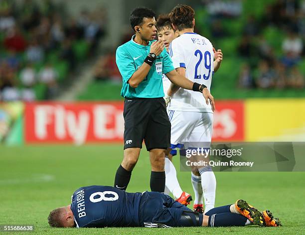 Besart Berisha of the Victory lays on the ground after taking a knock during the AFC Champions League match between the Melbourne Victory and Suwon...