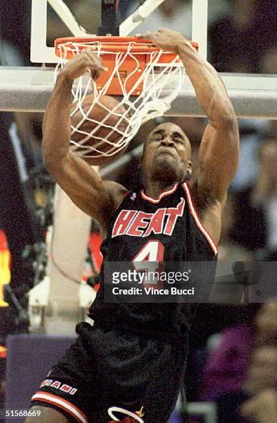 Using what he calls his "double-pump reverse," Harold Miner of the Miami Heat dunks the ball 11 February on his way to winning his second NBA...