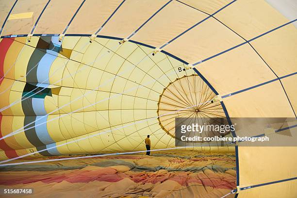 a man preparing hot air balloon at cappadocia - cappadocia hot air balloon stock pictures, royalty-free photos & images