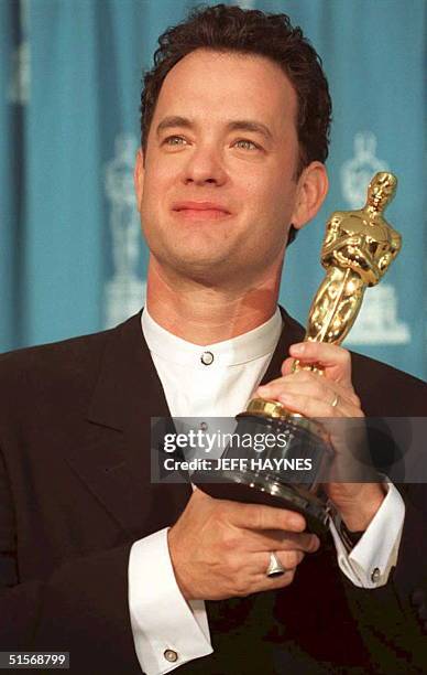 Actor Tom Hanks poses with his Oscar 27 March at the 67th annual Academy Awards in Los Angeles. Hanks won as best actor for his portrayal of "Forrest...