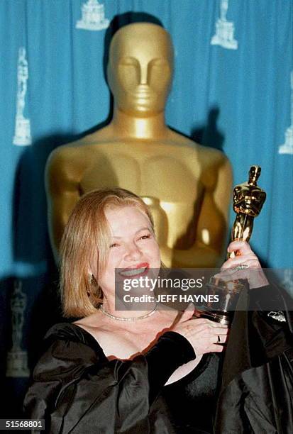 Actress Dianne Wiest smiles as she holds the Oscar she won during the 67th Annual Academy Awards, 27 March, in Los Angeles. Weist won the...