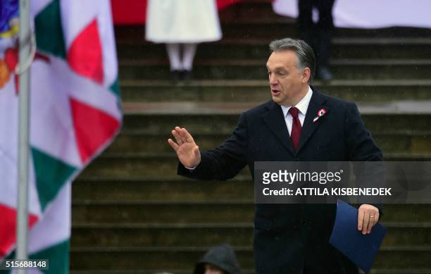 Hungarian Prime Minister Viktor Orban arrives to deliver a speech in front of the National Museum of Budapest on March 15, 2016 during official...