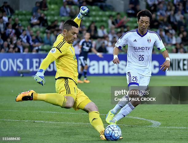 Daniel Vukovic of Melbourne Victory fires the ball clear of Yeom Ki Hun of the Suwon Samsung Bluewings during the AFC Champions League group stage...
