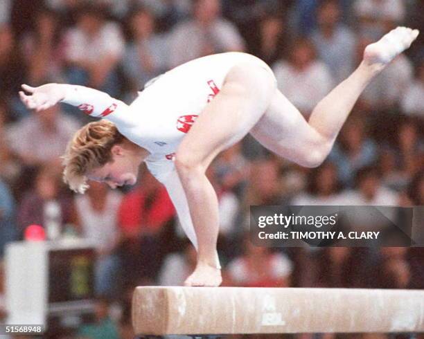 Gymnast Amanda Borden tries to keep her balance while performing on the balance beam during the women's all-round competition at the 12th Pan...