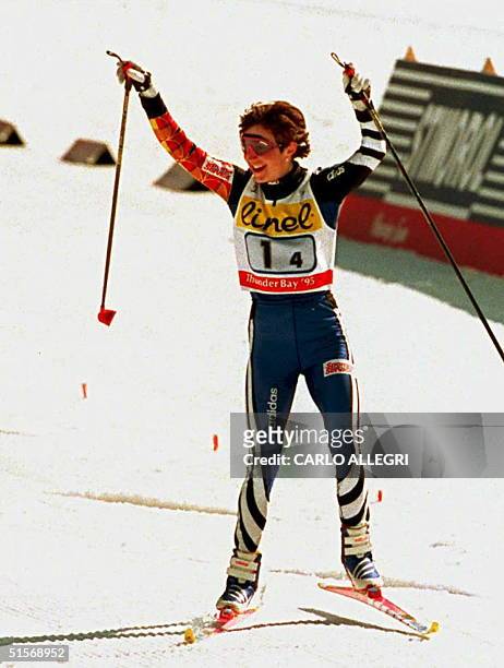 Russia's Nina Gavryljuk celebrates her win at the finish line after Women's 4X5 relay at the Nordic World Ski Championships 16 March in Thunder Bay,...
