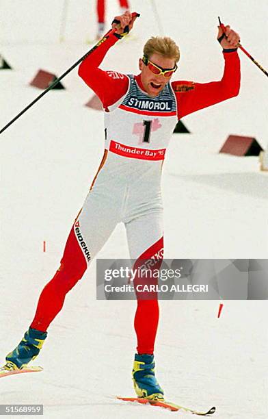 Skier Vladimir Smirnov of Khazakstan powers uphill on his way to victory in the Men's 15 km Pursuit Free Style race at the Nordic World Ski...