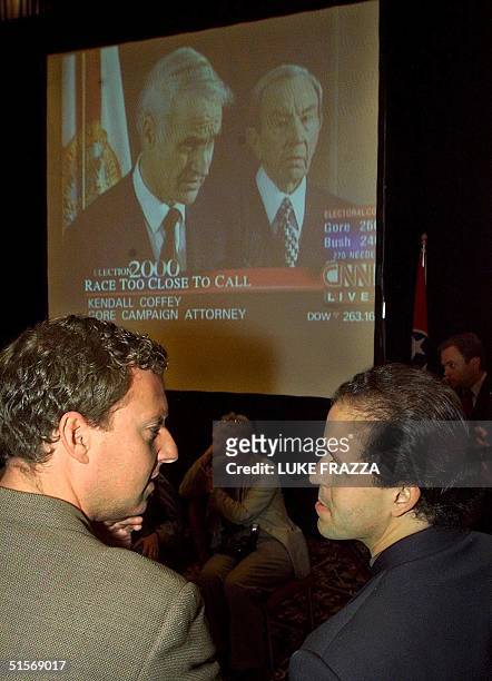 Democratic presidential candidate Al Gore's campaign spokesman Chris Lehane and traveling Chief-of-Staff Michael Feldman confer at the press filing...