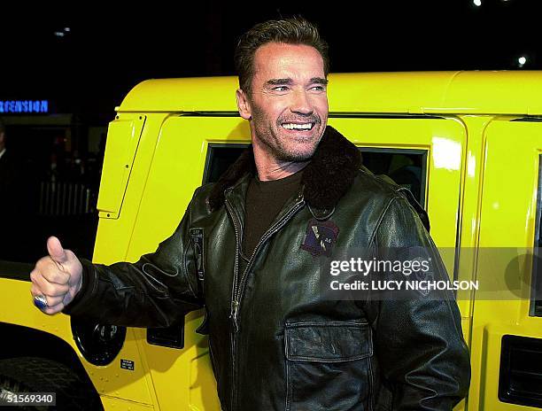 Austrian-born US actor Arnold Schwarzenegger arrives at the premiere of his new film "The 6th Day" in his yellow Hummer car, in Los Angeles, 13...