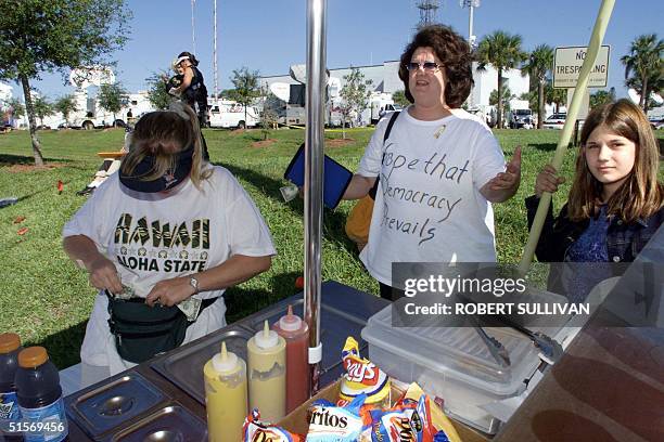 Camille Oliver a resident of Pennsylvania who came down to Florida to witness and participate in the Florida vote recount issue, wears a t-shirt that...