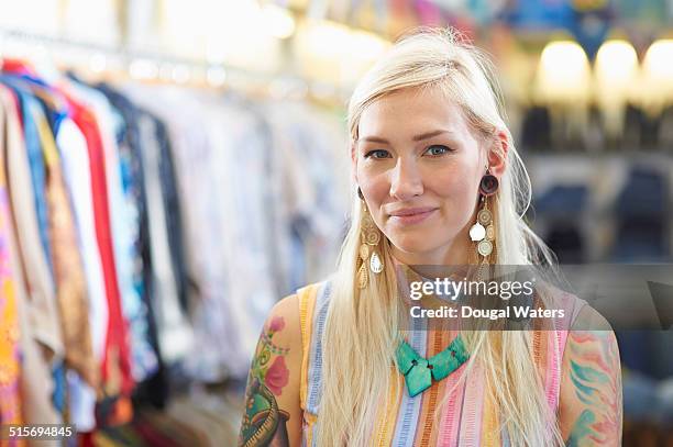 portrait of vintage clothes shop owner. - vestito multicolore foto e immagini stock