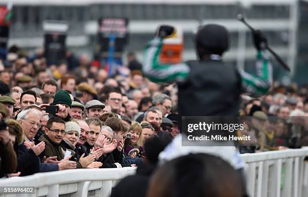 Nico de Boinville on board Altior salutes the crowd after winning the Sky Bet Supreme Novices' Hurdle at Cheltenham Racecourse on March 15, 2016 in...