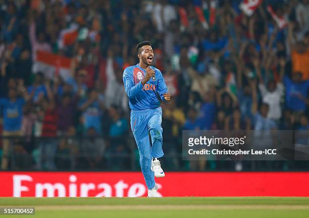 Hardik Pandya of India celebrates catching out Colin Munro of New Zealand during the ICC World Twenty20 India 2016 Group 2 match between New Zealand...