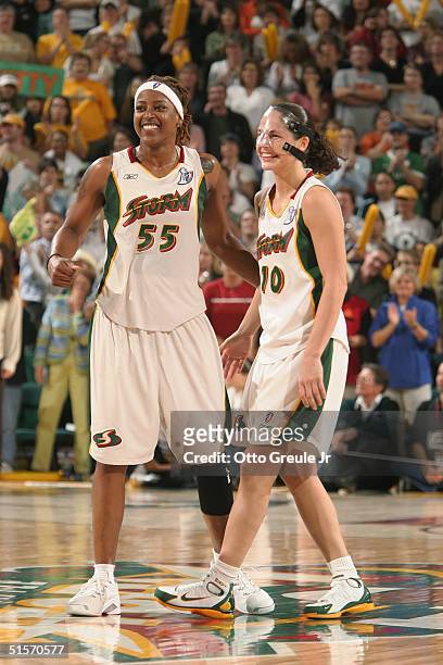 Sheri Sam and Sue Bird of the Seattle Storm celebrate in Game three of the WNBA Finals against the Connecticut Sun at Key Arena on October 12, 2004...