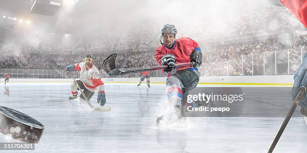 jugador de hockey sobre hielo de puntuación - hockey puck fotografías e imágenes de stock