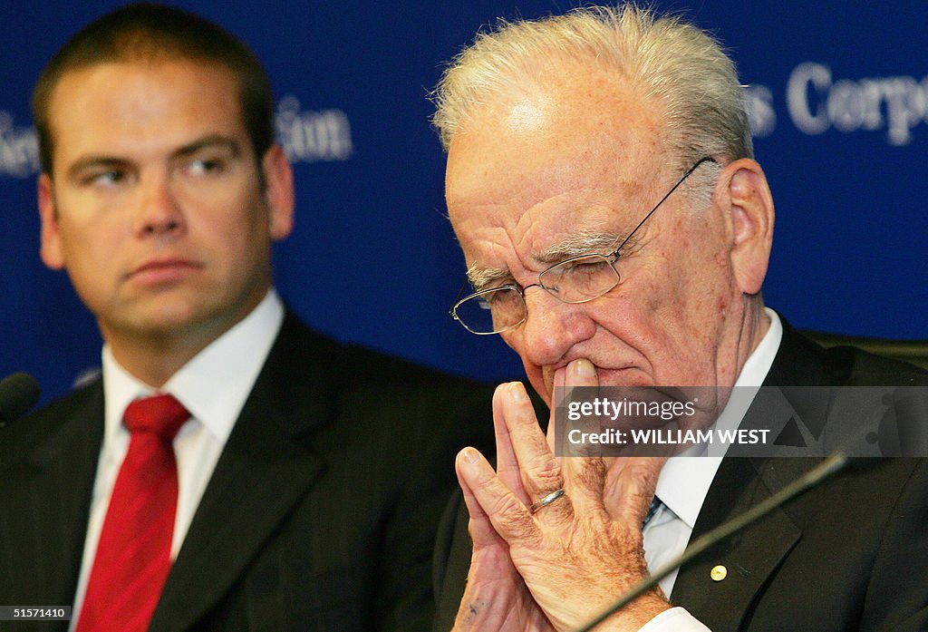 Rupert Murdoch (R), chairman of media he