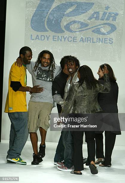 Designer Simone Berry with founders Evan Davis, Lando Felix and Tony Shelman walk down the runway at the Enyce/Lady Enyce Spring 2005 show during the...