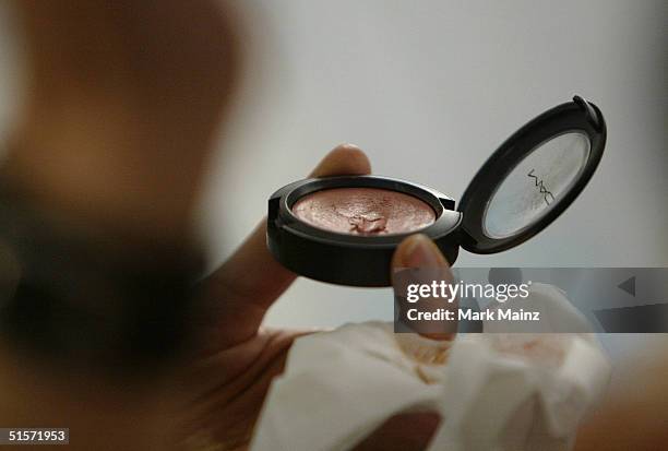 Model prepares backstage for the Enyce/Lady Enyce Spring 2005 show at the Mercedes-Benz Fashion Week at Smashbox Studios in Culver City, California.