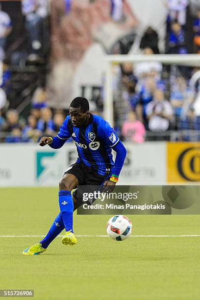 Ambroise Oyongo of the Montreal Impact plays the ball during the MLS game against the New York Red Bulls at the Olympic Stadium on March 12, 2016 in...