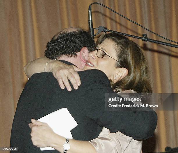 Nina Tassler , President of CBS Entertainment, hugs actor Jason Alexander after receiving the 2004 Vision Award during the 2004 Jewish Television...