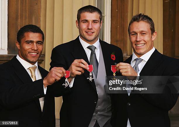 Jason Robinson, MBE, Ben Cohen, MBE and Jonny Wilkinson OBE, members of the England Rugby World Cup winning team at the OBE and MBE Investiture held...